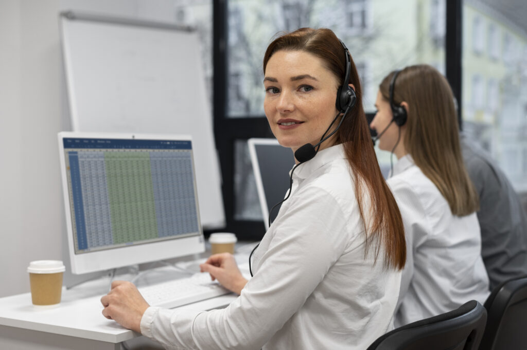Call centre agents improving customer service through communication and support tools in a modern office.